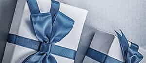 A grey, wrapped gift box with a ribbon.