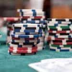 Casino chips at a card game table.