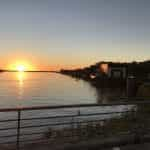 The sun sets over the water in Paraguay.