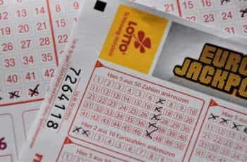 Euro Jackpot lottery tickets spread out on a flat surface.