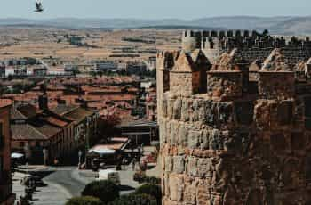 An old, picturesque stone building high over Avila, Spain.